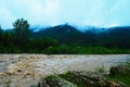 Dirty river current after rain. Mudslide concept. River flow with dirty water after heawy rain Royalty Free Stock Photo