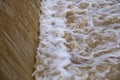 Dirty river current after rain. Mudslide concept. River flow with dirty water after heawy rain. Royalty Free Stock Photo