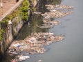 Dirty river in Dharavi slums. Mumbai. India. Royalty Free Stock Photo