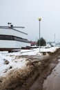 Dirty road with melted snow in the village Royalty Free Stock Photo