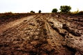 Dirty road after the rain. Clay highway in the countryside. The bottom point of the shooting