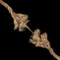 Dirty rope, frayed at both ends and ready to break apart with rope held together by a last strand ready to snap. Concept of Royalty Free Stock Photo