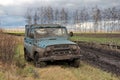 Dirty Russian car-terrain jeep UAZ-469 in the Russian field after jeeping off ro Royalty Free Stock Photo