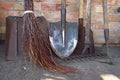Dirty rusty shovels, garden hoe, rake and broom
