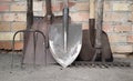 Dirty rusty shovels, garden hoe, rake and pitchfork