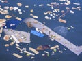 Dirty sea surface, people throw plastics food and chemicals in the sea