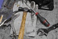 Dirty set of hand tools on table, Assorted work tools on table.