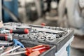 Dirty set of hand tools and wrenchs close-up in box. Garage painting car service. Tool to repair the car or replace Royalty Free Stock Photo