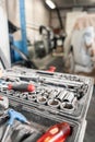 Dirty set of hand tools and wrenchs close-up in box. Garage painting car service. Tool to repair the car or replace Royalty Free Stock Photo