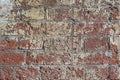 Dirty shabby painted brick surface, paints of different colors. Colorful grunge texture of wall