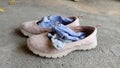 Dirty shoes woman and socks on cement floor Royalty Free Stock Photo