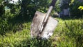 dirty shovel stuck in the ground Royalty Free Stock Photo