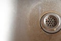 Dirty sink drain with leftover food. Stainless steel sink