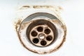 Dirty sink drain mesh, hole with limescale or lime scale and rust on it close up, dirty rusty bathroom washbowl Royalty Free Stock Photo