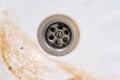 Dirty sink drain mesh, hole with limescale or lime scale and rust on it close up, dirty rusty bathroom washbowl Royalty Free Stock Photo