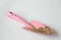 Dirty small pink shovel