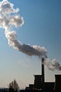 Dirty smoke on the sky from the pipes of the factory. Industrial chimneys air pollution Royalty Free Stock Photo