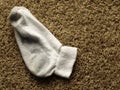 Dirty sock on the floor Royalty Free Stock Photo