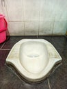 Dirty squat toilet