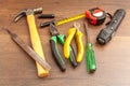 Dirty technician tools on wooden background