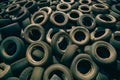 Dirty tires piled on floor, used automobile tyres in landfill