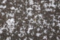 Dirty tracks of snow on asphalt on a small german road Royalty Free Stock Photo