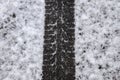 Dirty tracks of snow on asphalt on a small german road Royalty Free Stock Photo