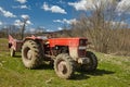 Dirty tractor on a field Royalty Free Stock Photo