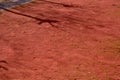 Dirty traditional boules court made of red sand Royalty Free Stock Photo