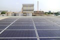 Dirty Unclean Solar Panels on Industrial Roof