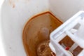Dirty unhygienic rusty and calcified flush tank of toilet with limescale and rust stains and scum close up need to be cleaned and Royalty Free Stock Photo