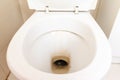 Dirty unhygienic toilet bowl with limescale stain at public restroom close up Royalty Free Stock Photo