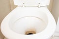 Dirty unhygienic toilet bowl with limescale stain at public restroom close up Royalty Free Stock Photo