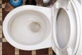 Dirty unhygienic toilet bowl with limescale stain at public restroom, top view