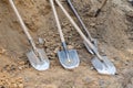 Dirty used shovels are thrown to the ground during the lunch break.