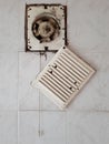 Dirty ventilation air grille with fan at home close up on white wall. Dust condition technology, dangerous old house air Royalty Free Stock Photo