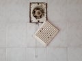 Dirty ventilation air grille with fan at home close up on white wall. Dust condition technology, dangerous old house air Royalty Free Stock Photo