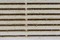 Dirty ventilation grill indoors close up. Concept: maintenance of ventilation, prevention