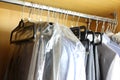 Dirty wardrobe with various men clothes