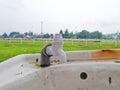 Dirty wastafel and white faucet near grass field of horse racing track or site Royalty Free Stock Photo