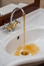 Dirty water flows from the faucet Royalty Free Stock Photo