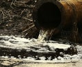 Dirty water flows out of old rusty pipe without cleaning