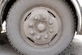 Dirty wheel of the bus wheel hub bearing in the daylight Royalty Free Stock Photo