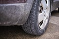 Dirty wheel of a car tire due to salt