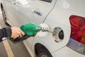 Dirty white car refueling Royalty Free Stock Photo