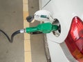 Dirty white car refueling Royalty Free Stock Photo
