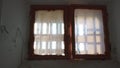 Dirty window with metal bars in the prison cell.