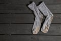 dirty womens blue socks lie on a black wooden table,dirty socks