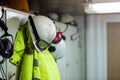 Dirty worker protective clothing hanging in the locker room.