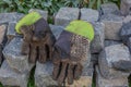 Work gloves lying on a huddle of cobblestones